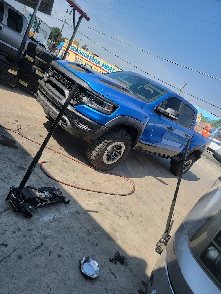 Blue Ram TRX lifted truck getting tire service